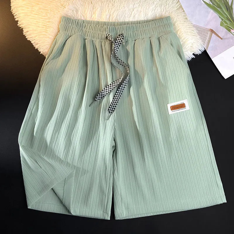 Summer thin shorts men's new style ice silk loose breathable hanging feeling student five quarter pants embroidered logo straigh