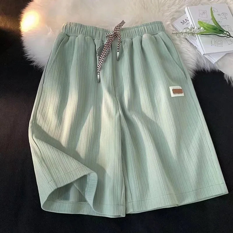 Summer thin shorts men's new style ice silk loose breathable hanging feeling student five quarter pants embroidered logo straigh